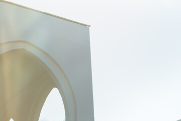 Fototapeta premium White wall part of Egypt architecture against white morning sky. 