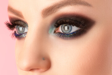 beautiful woman eyes closeup with black makeup