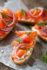 Sandwich with smoked salmon and cream cheese on a crispy baguette