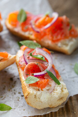 Sandwich with smoked salmon and cream cheese on a crispy baguette