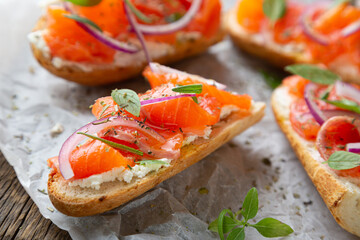 Sandwich with smoked salmon and cream cheese on a crispy baguette
