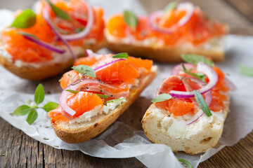 Sandwich with smoked salmon and cream cheese on a crispy baguette