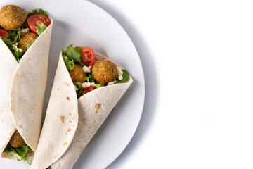 Tortilla wrap with falafel and vegetables isolated on white background. Top view. Copy space
