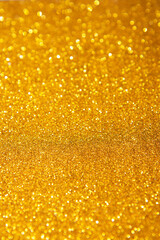 Sparkling background made of lights. Festive blurred backdrop. Abstract golden trendy backdrop. Colorful bright background. Flat lay