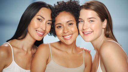 Beauty Portrait of Three Diverse Multiethnic Models on Isolated Background. Beautiful Happy Asian,...