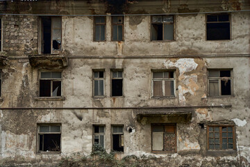 Abandoned crumbling buildings in a residential city. A dying city. Frightening atmosphere