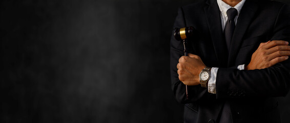 A Male lawyer or judge hand with gavel, Law, Justice lawyers at law firm, Law and Legal services concept.