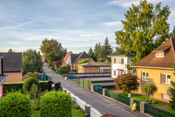 A street with typical family houses in a suburban area near Berlin. Houses in Blankenfelde-Mahlow,  a municipality in the Teltow-Flaeming district of Brandenburg, Germany. 