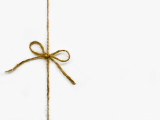 Twine tied in a bow isolated on white background