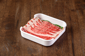 Red meat slice on wooden background. Food for healthy.