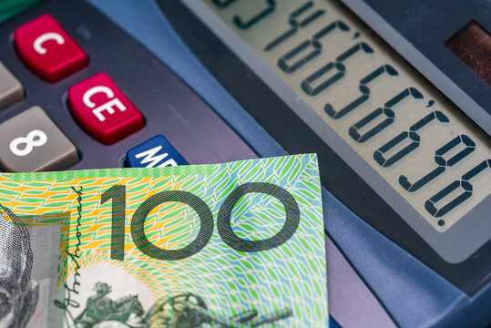 Australian dollar on calculator. Macro photo.