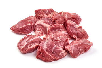 Raw pork pieces, ingredients for goulash, close-up, isolated on white background.