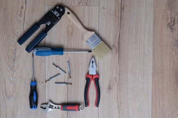 A set of tools for home repair lies on the floor, close-up