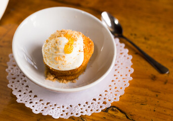 Delicious dessert - carrot cake with orange crumbs clos eup