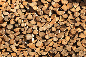 Stacked logs firewood texture background