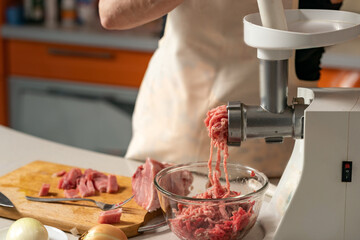 female hands cutting meat for minced meat