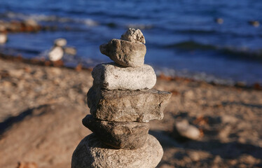 balanced stone over waterfront