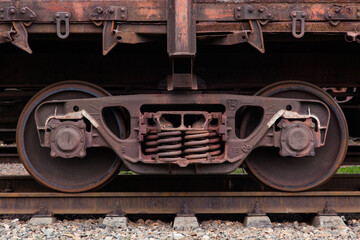 Wheels of a railway train close-up.