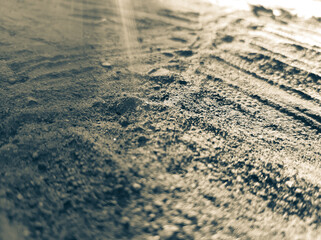 Fototapeta na wymiar Tire tracks on the sand.