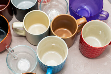 empty mugs of different shapes and sizes on the table