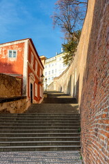 Prague in the morning, stone stairs against the blue sky, cityscape
