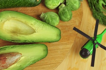 Green helicopter and vegetables import export of healthy food concept