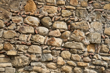 Rock stone texture. A wall built of mountain stones