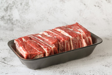 raw beef ribs are on the table