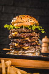 Follow @neropimePerfect Burger Classic Homemade Artisan Bacon Milk Shake Tomato Sauce Sausage Sweet Melted Cheese Onion Chicken Meat Shrimp Menu Gourmet on a Dark Backgroundntel