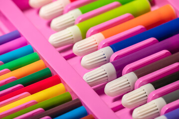 Multicolored markers in pencil case.