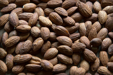 Brown almond nuts Natural background