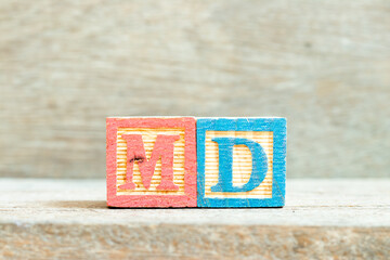 Color alphabet letter block in word MD (abbreviation of doctor of medicine or managing director) on...