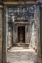 Fototapeta na wymiar Sri Lanka. Buddha statue in the ancient Buddhist stone temple of Nalanda Gedige. A popular attraction.