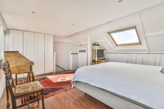 Comfortable white bed in mansard