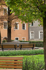 Beauiful garden in the city centre of Innsbruck, Austria, with surrounding historic buildings