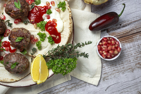 Traditional homemade beef and lamb meatballs with arabic bread