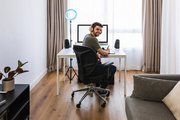 Designer working on computer with graphic tablet