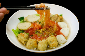 Die cut of Fish Ball Noodles on black isolated.