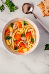 Chicken soup with noodles and vegetables