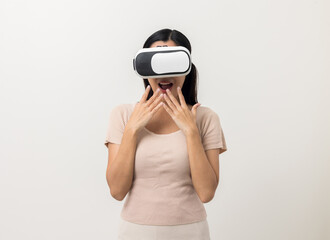 Young asian woman put on vr glasses into virtual simulated world. Future technology cyber universe. Enjoying an Experiences of Virtual World. Attractive asian woman on isolated white background