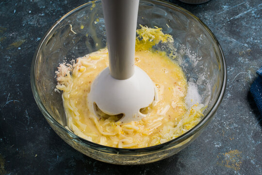 Hand blender mixing ingredients for chaffles