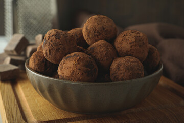 Concept of sweets with truffles on wooden board
