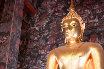 Giant golden Buddha statue front Thai acient art living style in Buddhist temple., Bangkok, Thailand