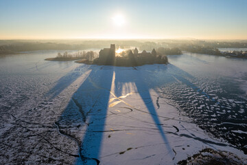 Aerial winter sunny day view of frozen Galve lake in Trakai, Lithuania - obrazy, fototapety, plakaty