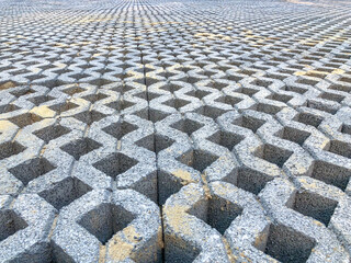 Fototapeta premium gray color stone brick block floor tile with green grass and sand as background or texture.