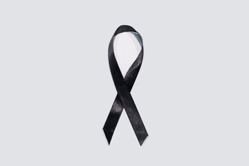 Black awareness ribbon on white background. Mourning and melanoma symbol
