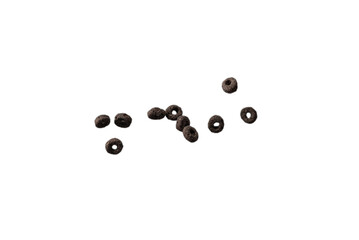 Chocolate rings cereal spill out into a bowl. Breakfast.