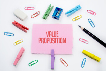Value Proposition written on Set of colorful paper clips with white copy space background