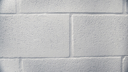 Concrete block wall seamless background. Old white stone bricks.