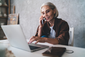 Female entrepreneur working at table at art studio